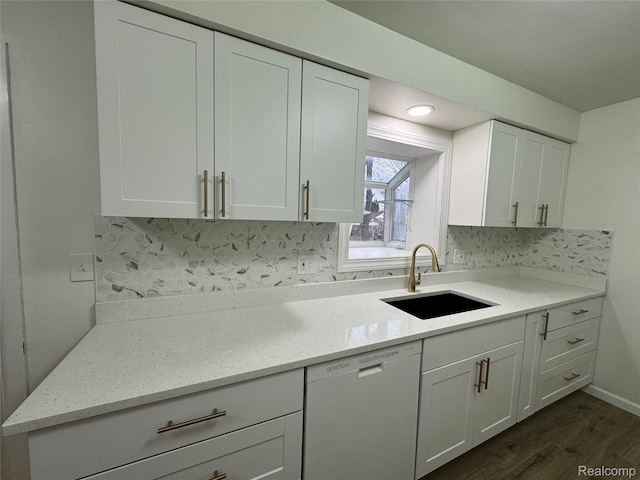 8511 Allen Rd, Allen Park, MI 48101 - kitchen with dishwashing machine, a sink, dark wood-style flooring, white cabinets, and decorative backsplash