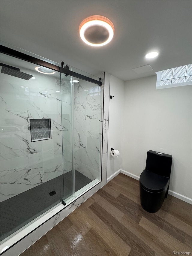 8511 Allen Rd, Allen Park, MI 48101 - bathroom featuring a marble finish shower, toilet, wood finished floors, and baseboards