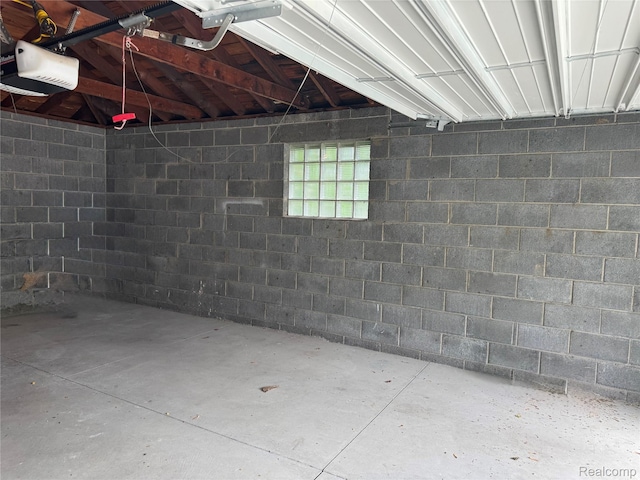 8511 Allen Rd, Allen Park, MI 48101 - garage with a garage door opener and concrete block wall