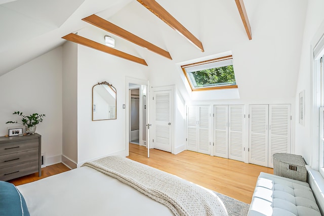 1512 Brooklyn Ave, Ann Arbor, MI 48104 - bedroom featuring a skylight, light wood-type flooring, high vaulted ceiling, beam ceiling, and baseboards