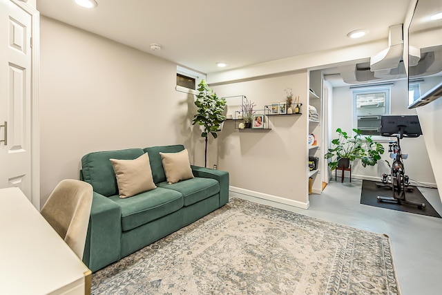 1512 Brooklyn Ave, Ann Arbor, MI 48104 - living area featuring finished concrete flooring, baseboards, and recessed lighting