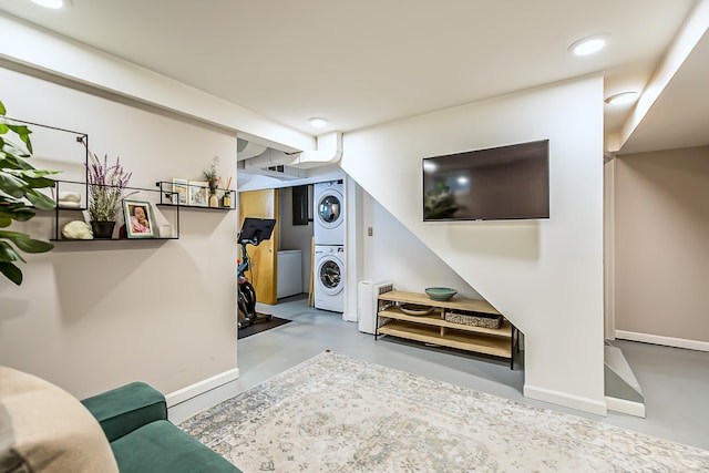 1512 Brooklyn Ave, Ann Arbor, MI 48104 - living room with stacked washer / dryer, concrete floors, recessed lighting, and baseboards