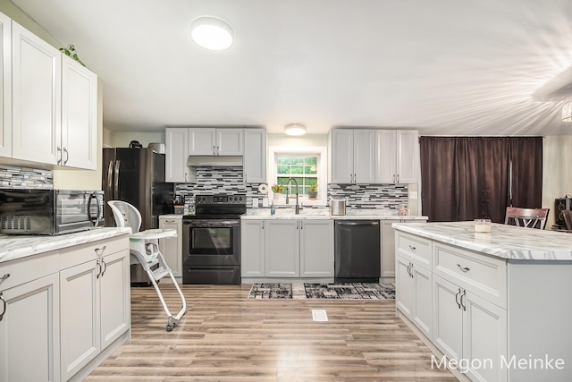 7813 River St, Belding, MI 48809 - kitchen featuring electric range oven, dishwasher, a sink, and backsplash