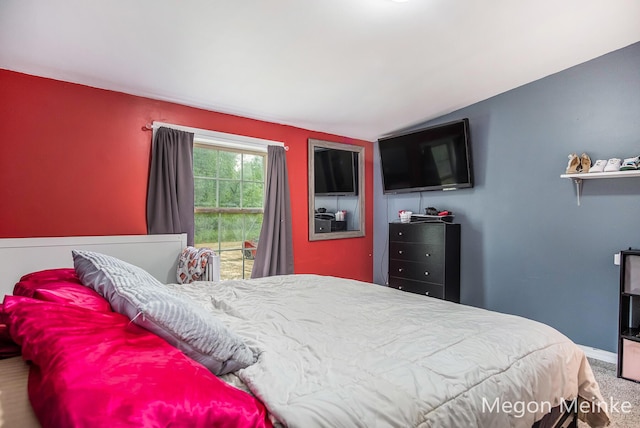 7813 River St, Belding, MI 48809 - bedroom featuring vaulted ceiling and carpet flooring
