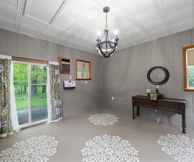 4841 Pear Way, Farwell, MI 48622 - unfurnished dining area featuring a chandelier, an ornate ceiling, a wall mounted air conditioner, and wood walls