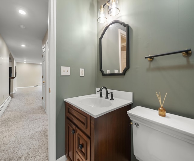 4841 Pear Way, Farwell, MI 48622 - bathroom with toilet, vanity, baseboards, and recessed lighting