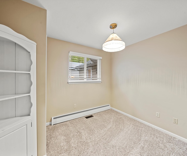 4841 Pear Way, Farwell, MI 48622 - spare room featuring a baseboard heating unit, carpet flooring, and baseboards