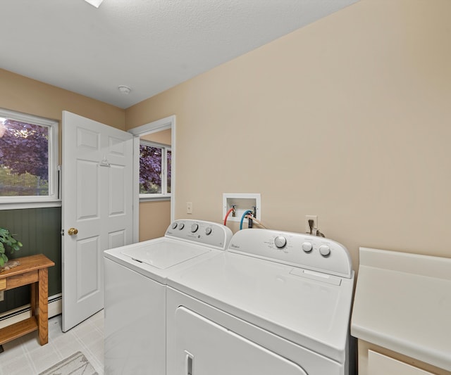 4841 Pear Way, Farwell, MI 48622 - laundry room with separate washer and dryer, healthy amount of natural light, and a baseboard heating unit