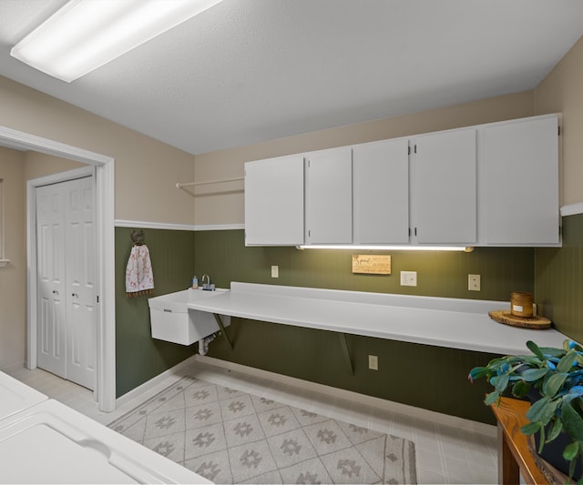 4841 Pear Way, Farwell, MI 48622 - kitchen featuring white cabinetry, light countertops, and baseboards