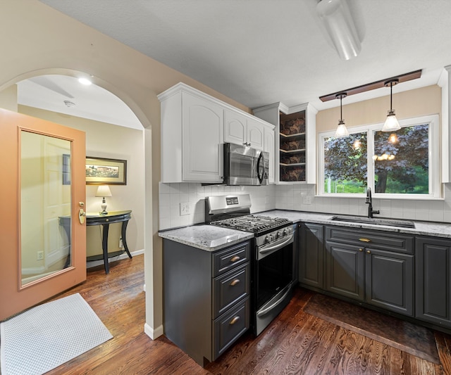 4841 Pear Way, Farwell, MI 48622 - kitchen with stainless steel appliances, a sink, white cabinets, and light stone countertops