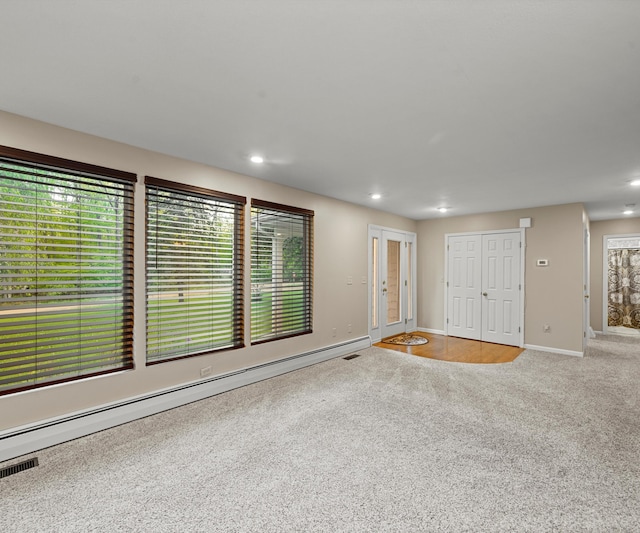 4841 Pear Way, Farwell, MI 48622 - unfurnished living room with carpet floors, baseboard heating, baseboards, and recessed lighting