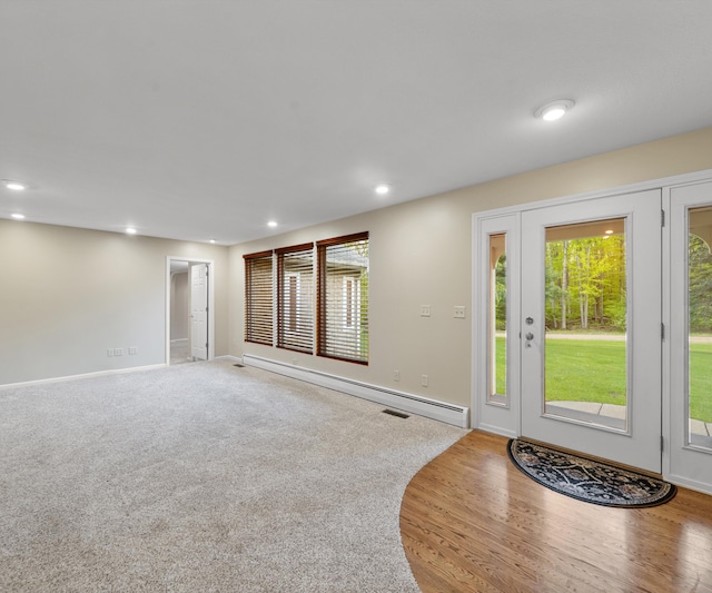 4841 Pear Way, Farwell, MI 48622 - foyer with baseboard heating, recessed lighting, baseboards, and wood finished floors