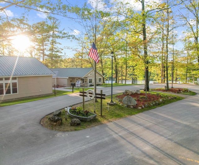 4841 Pear Way, Farwell, MI 48622 - view of home's community with concrete driveway and a lawn