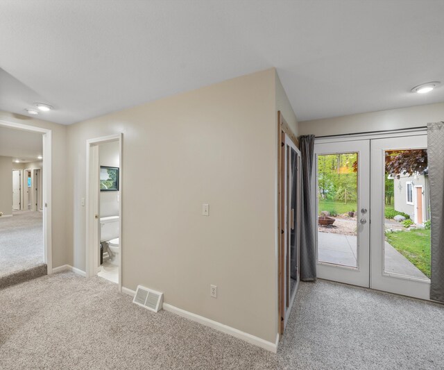 4841 Pear Way, Farwell, MI 48622 - carpeted empty room featuring french doors and baseboards