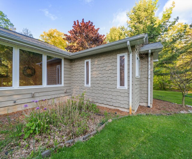 4841 Pear Way, Farwell, MI 48622 - view of side of home with a lawn