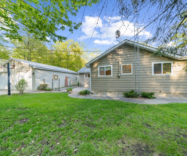 4841 Pear Way, Farwell, MI 48622 - back of property featuring a yard and crawl space