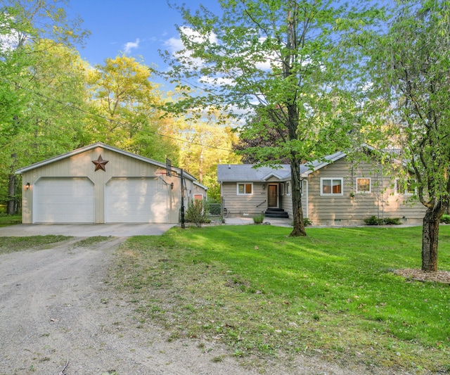 4841 Pear Way, Farwell, MI 48622 - view of front of property with a detached garage, a front lawn, an outbuilding, and entry steps