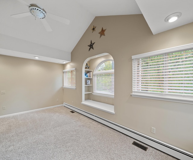 4841 Pear Way, Farwell, MI 48622 - carpeted spare room featuring a baseboard radiator, high vaulted ceiling, a ceiling fan, baseboards, and built in features