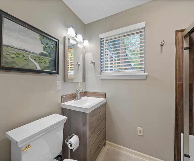 4841 Pear Way, Farwell, MI 48622 - bathroom featuring vanity, toilet, and baseboards