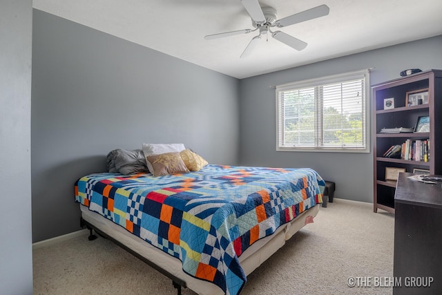 1705 Fritz St, Marne, MI 49435 - carpeted bedroom with baseboards and ceiling fan