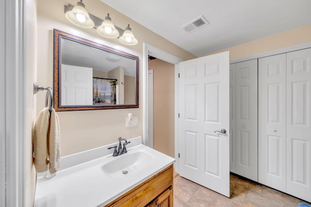 18685 Kreig Dr, Big Rapids, MI 49307 - bathroom with a closet and vanity