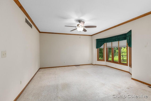 2870 S Wentward Ct, Hudsonville, MI 49426 - carpeted empty room featuring baseboards, ornamental molding, and ceiling fan