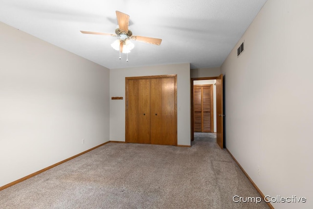 2870 S Wentward Ct, Hudsonville, MI 49426 - unfurnished bedroom featuring light carpet, a closet, baseboards, and a ceiling fan
