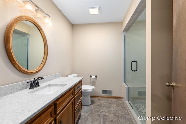 2870 S Wentward Ct, Hudsonville, MI 49426 - bathroom featuring vanity, toilet, a stall shower, and baseboards
