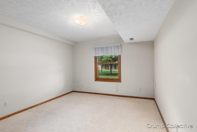 2870 S Wentward Ct, Hudsonville, MI 49426 - unfurnished room featuring a textured ceiling, baseboards, and carpet flooring