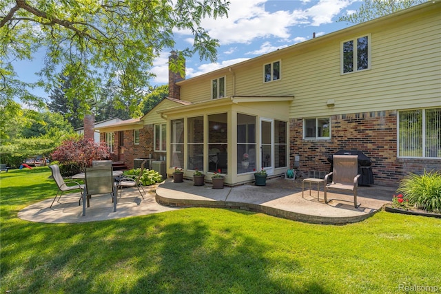 29832 High Valley Ct, Farmington Hills, MI 48331 - back of property with a patio, brick siding, a chimney, a sunroom, and a yard