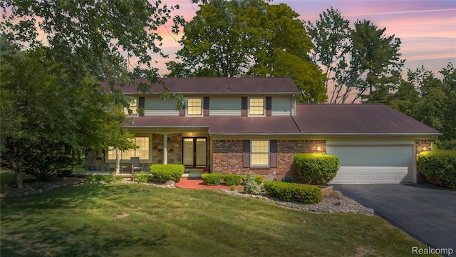 29832 High Valley Ct, Farmington Hills, MI 48331 - traditional-style home featuring a garage, asphalt driveway, a lawn, brick siding, and covered porch