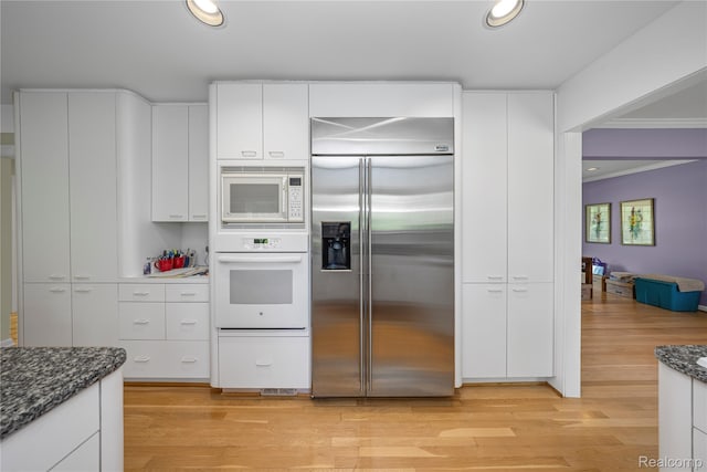 29832 High Valley Ct, Farmington Hills, MI 48331 - kitchen with built in appliances, light wood finished floors, white cabinetry, dark stone counters, and recessed lighting