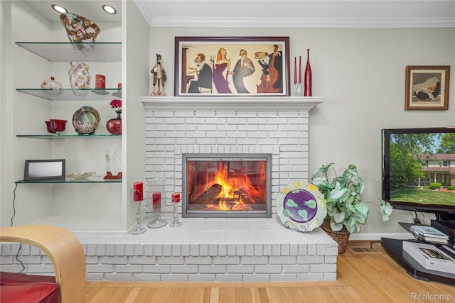 29832 High Valley Ct, Farmington Hills, MI 48331 - living area featuring wood finished floors, a fireplace, ornamental molding, and recessed lighting