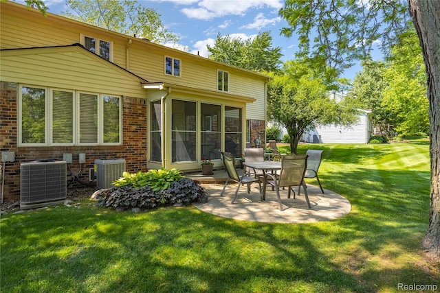 29832 High Valley Ct, Farmington Hills, MI 48331 - back of house with a patio area, brick siding, a yard, and a sunroom