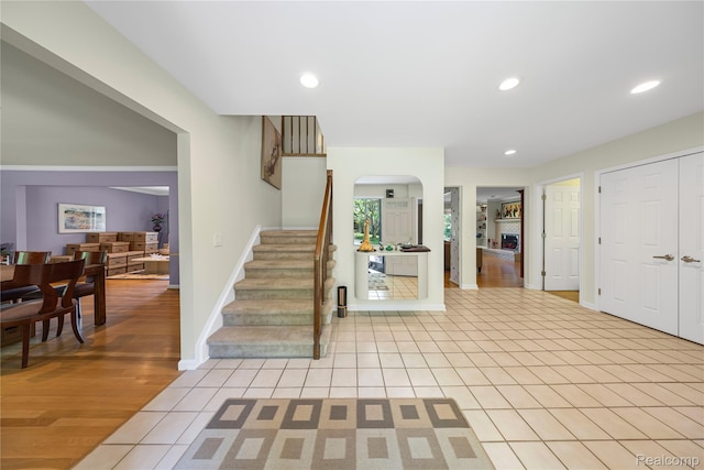 29832 High Valley Ct, Farmington Hills, MI 48331 - stairway with arched walkways, tile patterned floors, and recessed lighting