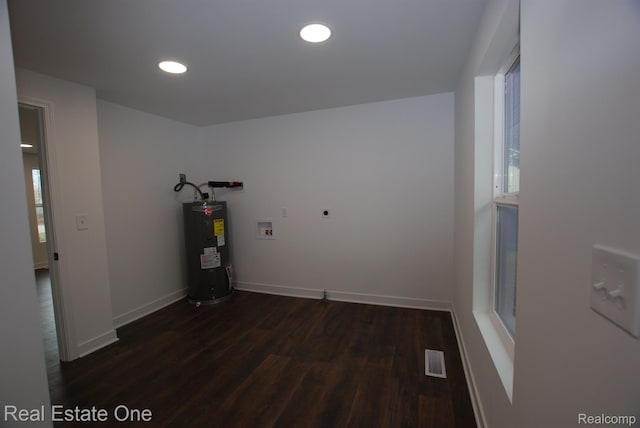 12357 Raymond Dr, Clio, MI 48420 - laundry room featuring hookup for an electric dryer, electric water heater, dark wood finished floors, recessed lighting, and hookup for a washing machine