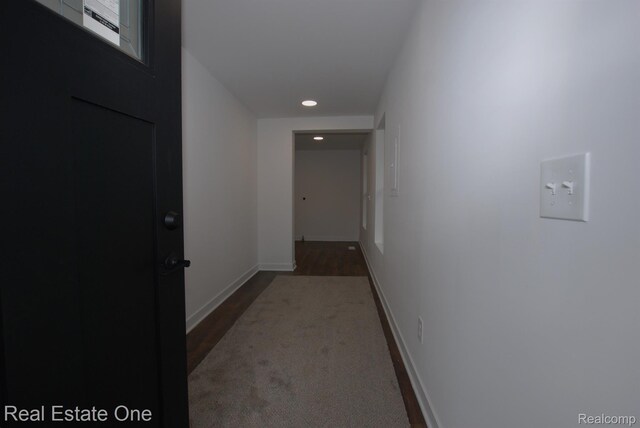 12357 Raymond Dr, Clio, MI 48420 - hall featuring recessed lighting, wood finished floors, and baseboards