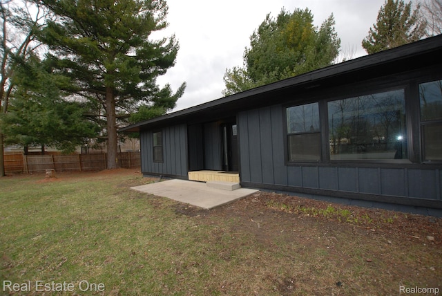 12357 Raymond Dr, Clio, MI 48420 - rear view of house with board and batten siding