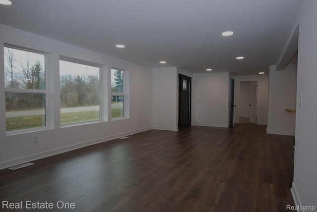 12357 Raymond Dr, Clio, MI 48420 - empty room with dark wood finished floors, recessed lighting, and baseboards