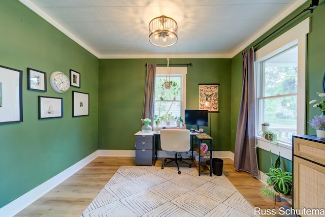 1227 Columbus Ave, Grand Haven, MI 49417 - home office with healthy amount of natural light, baseboards, light wood-style floors, and ornamental molding