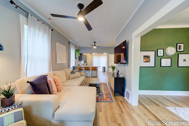 1227 Columbus Ave, Grand Haven, MI 49417 - living room with crown molding, ceiling fan, light wood-style flooring, and baseboards