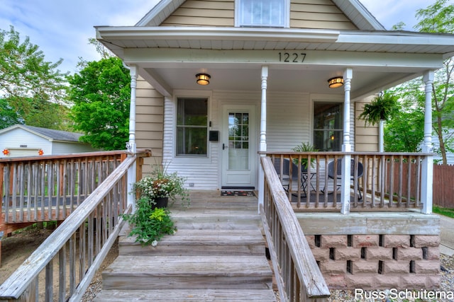 1227 Columbus Ave, Grand Haven, MI 49417 - view of exterior entry featuring a deck
