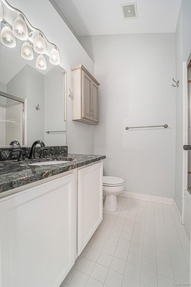 170 Allenhurst Ave, Royal Oak, MI 48067 - full bathroom featuring a shower with door, vanity, toilet, tile patterned flooring, and baseboards