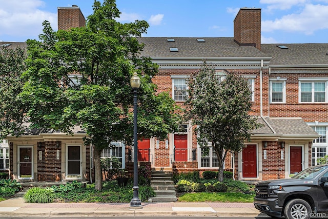 170 Allenhurst Ave, Royal Oak, MI 48067 - view of property featuring brick siding, roof with shingles, and a chimney