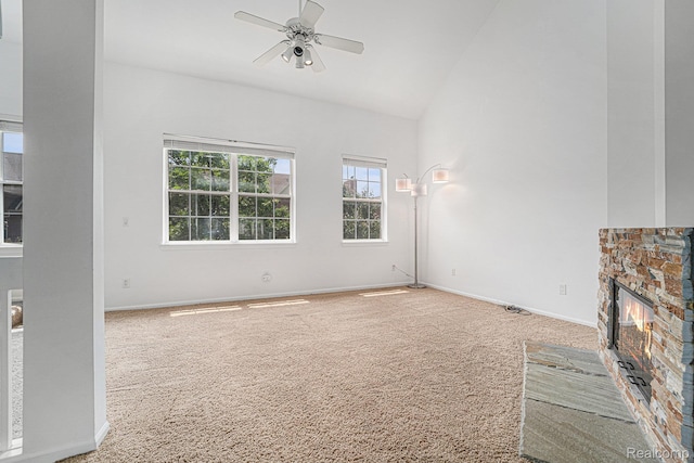 170 Allenhurst Ave, Royal Oak, MI 48067 - unfurnished living room with carpet floors, ceiling fan, baseboards, a stone fireplace, and high vaulted ceiling