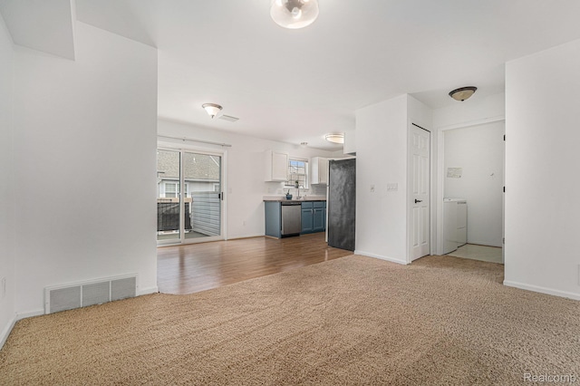 170 Allenhurst Ave, Royal Oak, MI 48067 - unfurnished living room with carpet floors, washer / clothes dryer, and baseboards