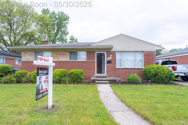 7265 Hillside Dr, Dearborn, MI 48127 - bungalow-style house featuring a front yard and brick siding