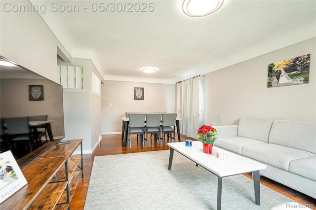 7265 Hillside Dr, Dearborn, MI 48127 - living room featuring dark wood-style flooring and baseboards