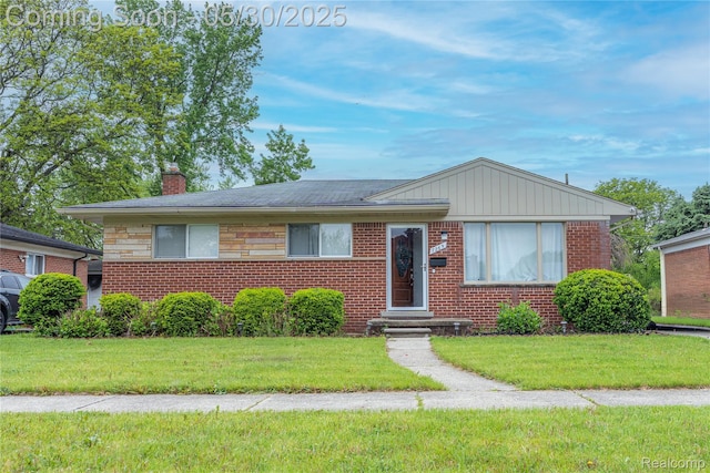7265 Hillside Dr, Dearborn, MI 48127 - bungalow with a chimney, a front yard, and brick siding