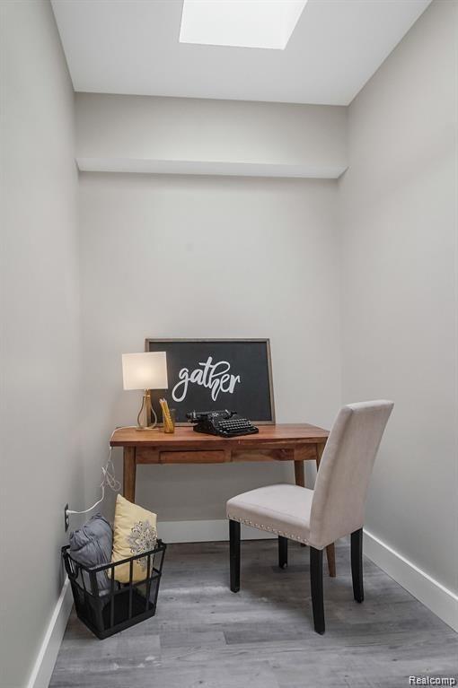 344 Main St Unit 300, Milford, MI 48381 - office area with a skylight, baseboards, and wood finished floors